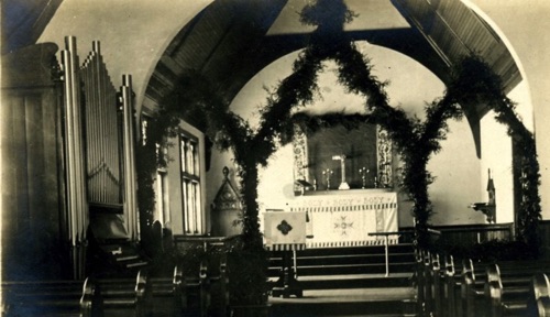 St. Paul's Episcopal Church decorated for Christmas in an early 1900s post card. chs-006482
